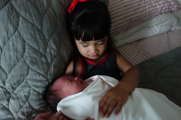 Cuddling with Baby Isa for the first time.