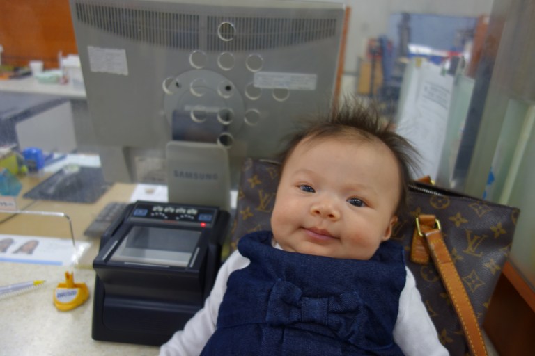 Isa waited patiently to be registered as an alien.