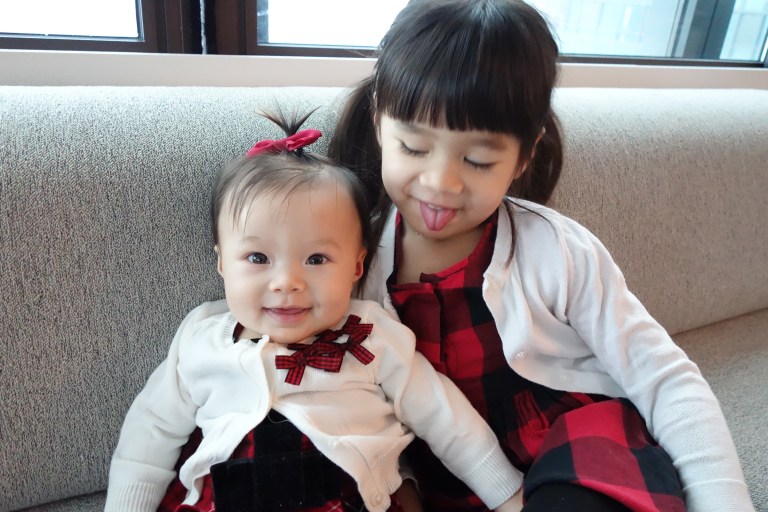 Isabel at four months, with her sister Eva, who's three years old.