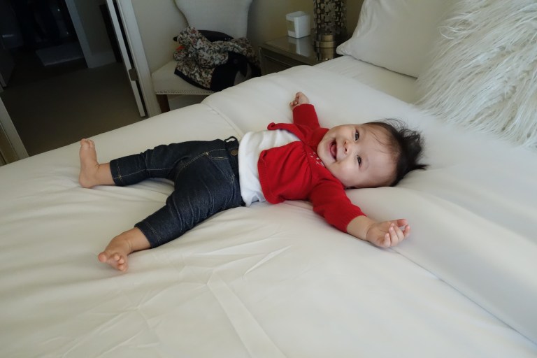 Isabel tries out a new bed at our Washington airbnb rental.