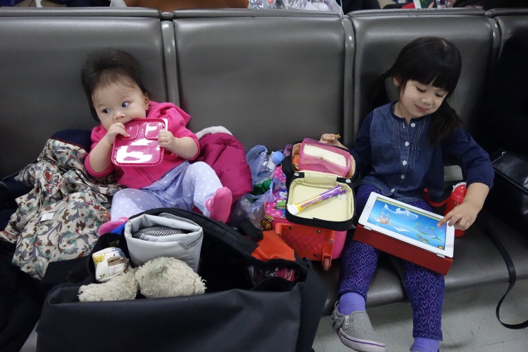 Isabel and sister Eva, waiting to board an evening flight.