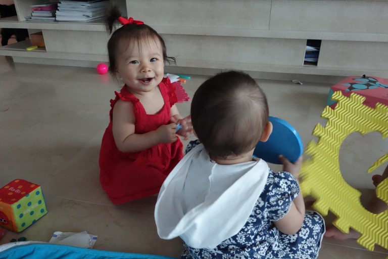 Social butterfly Isa usually plays with her much larger sister, so she delights in having another baby around. Someone her size for a change!