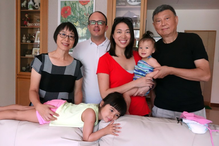 Oma, Dad, Mom, Isabel, Opa and sister Eva, sprawled on couch.